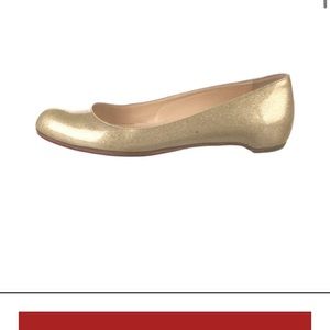 Gold Christian Louboutin flats